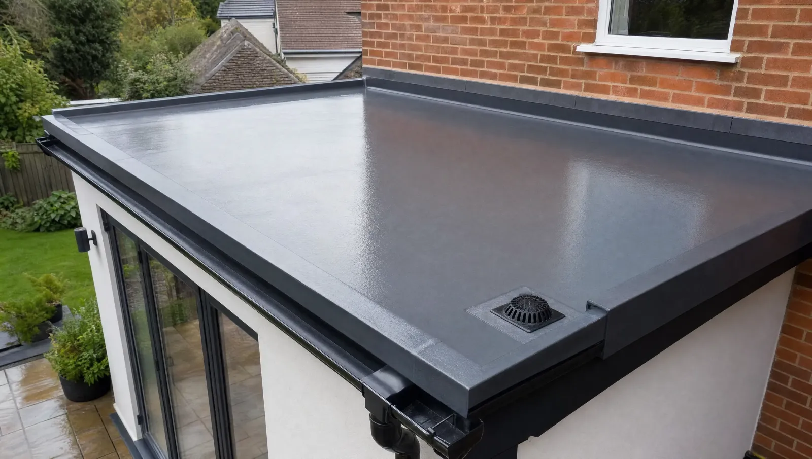 Clean residential flat roof with drainage outlet