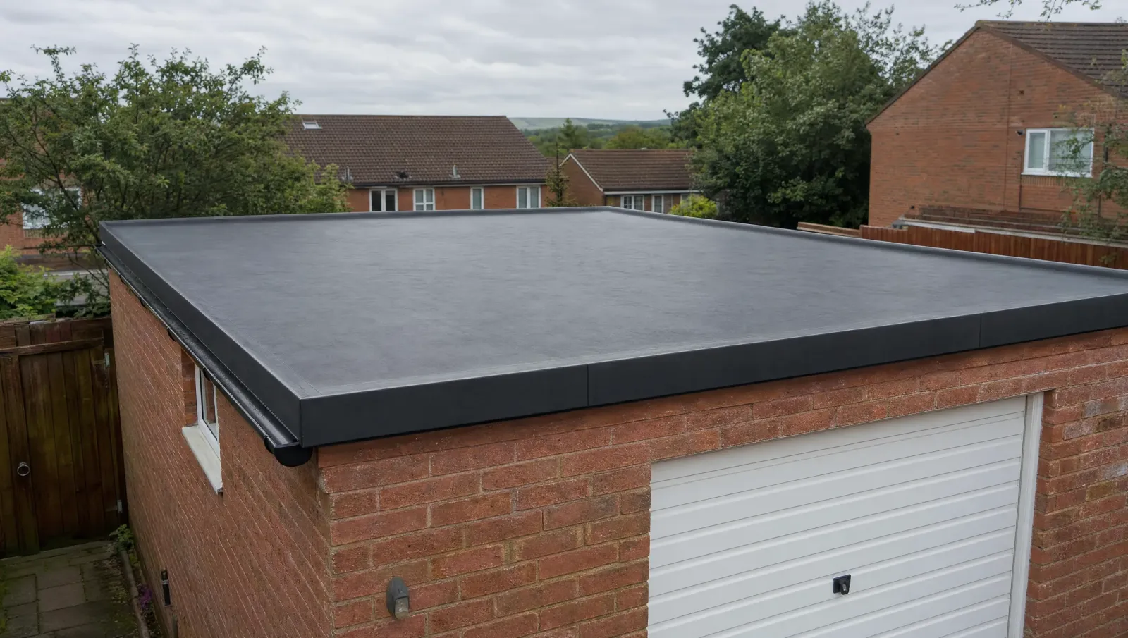 New EPDM roof installed on a detached brick garage