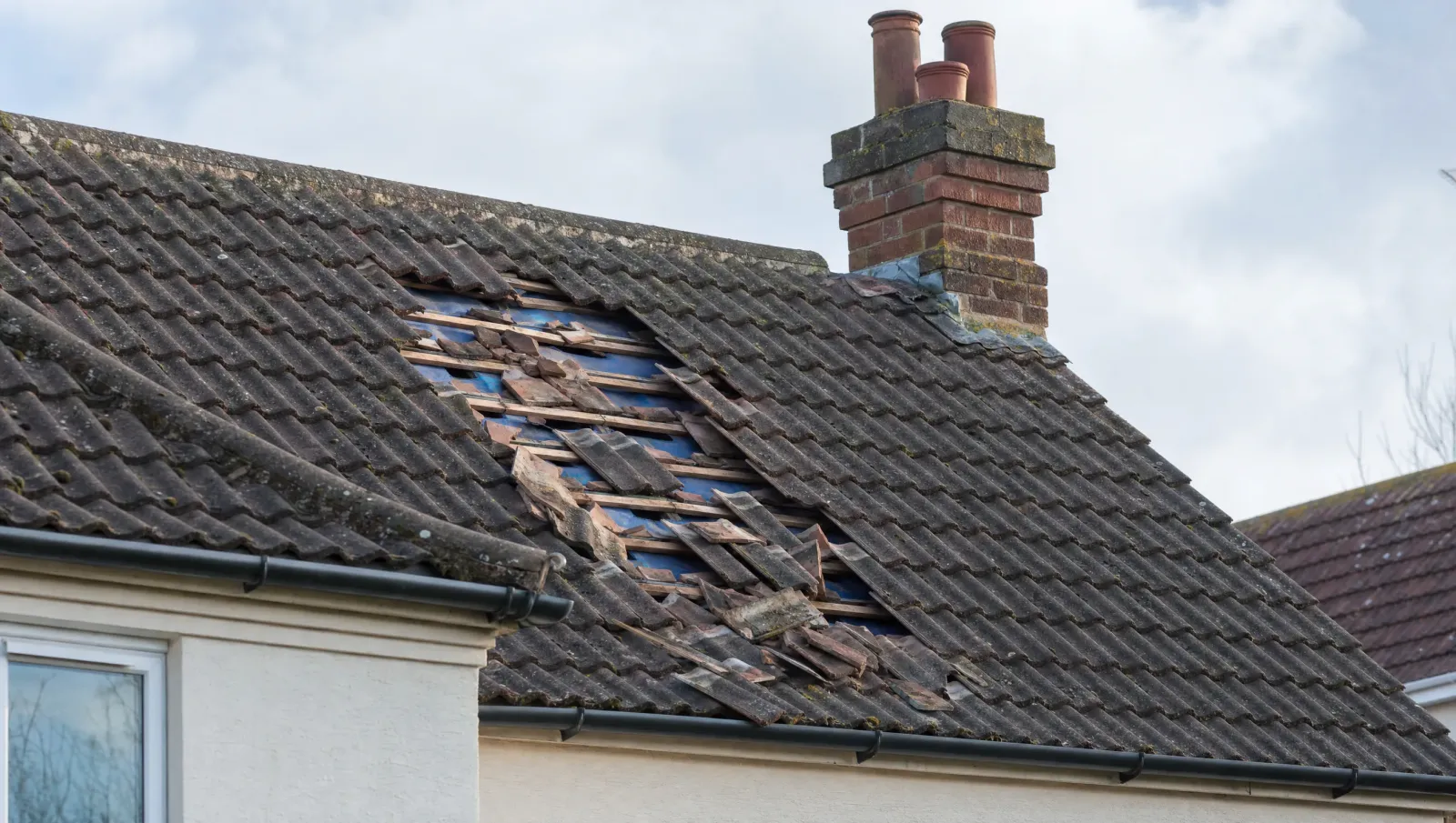 Wind-damaged roof tiles after a West Midlands storm